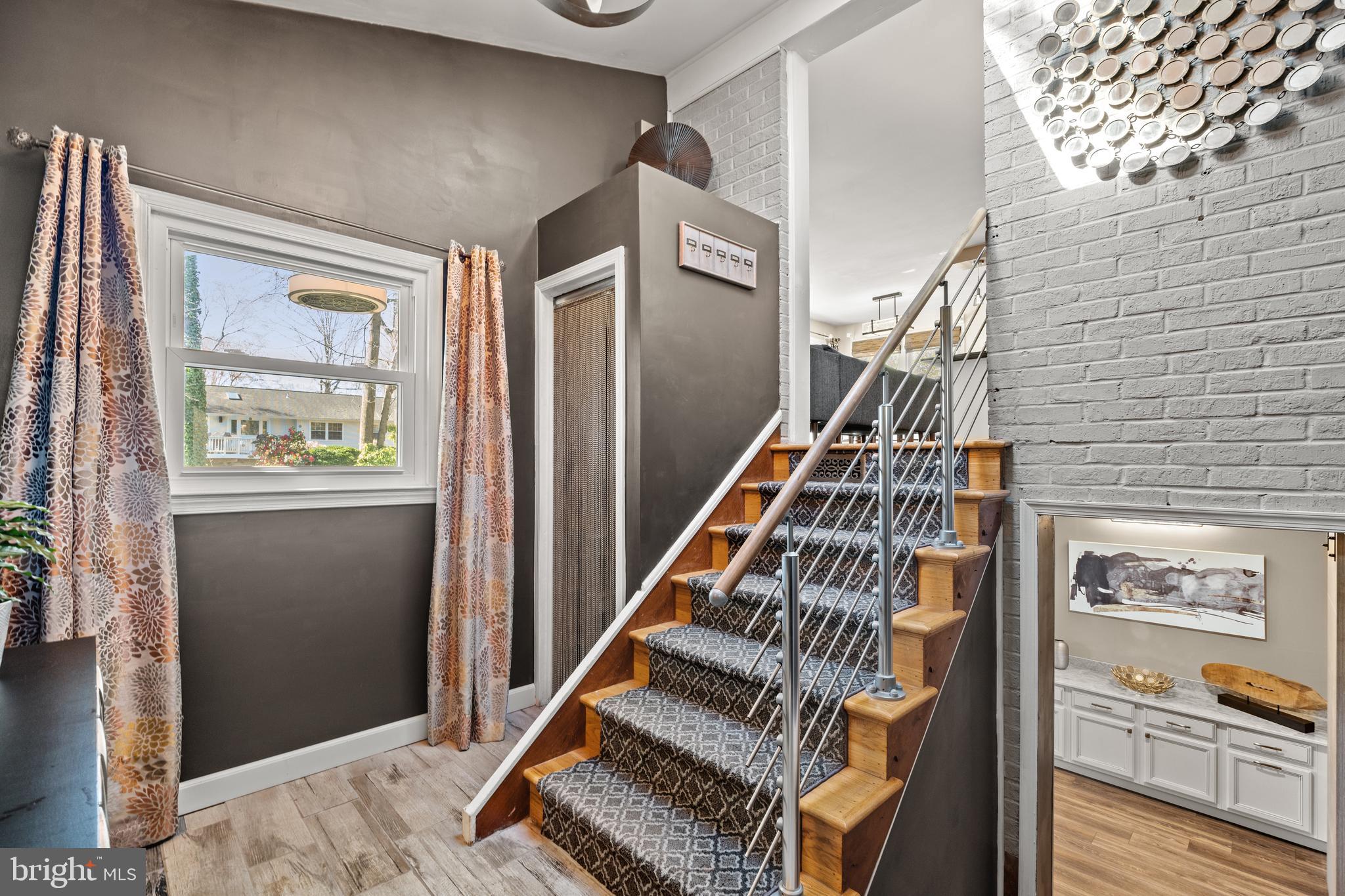 2411 Culpeper Road Alexandria, VA 22308 - Photo 2 of 36 Foyer w/new carpet, skylight, & modern railing.