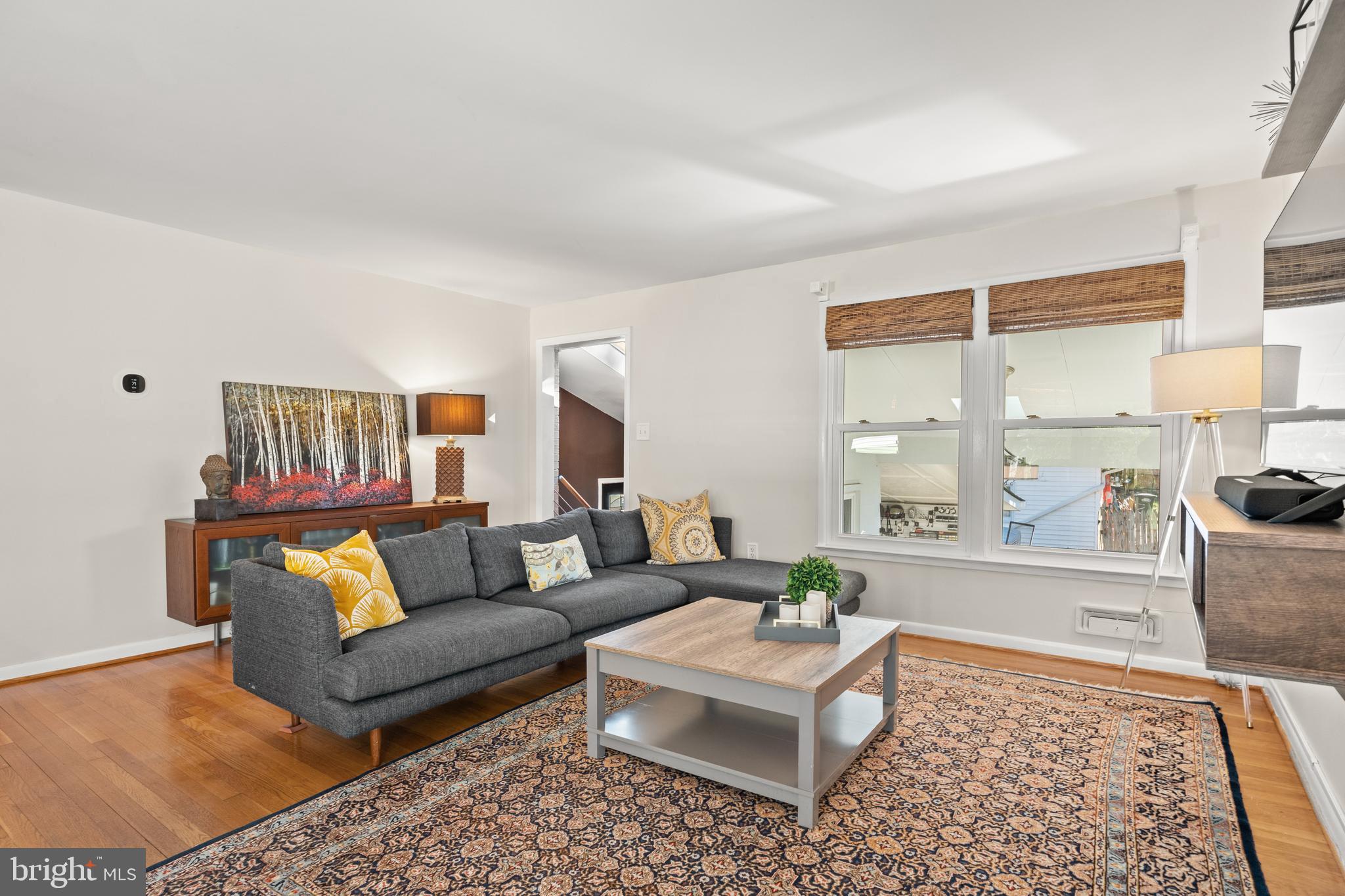 2411 Culpeper Road Alexandria, VA 22308 - Photo 4 of 36 Bright and airy Living Room w/bamboo shades.