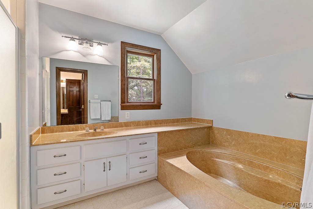 13661 Kingsmill Road Midlothian, VA 23113 - Photo 29 of 50 a bathroom with a tub a sink and mirror