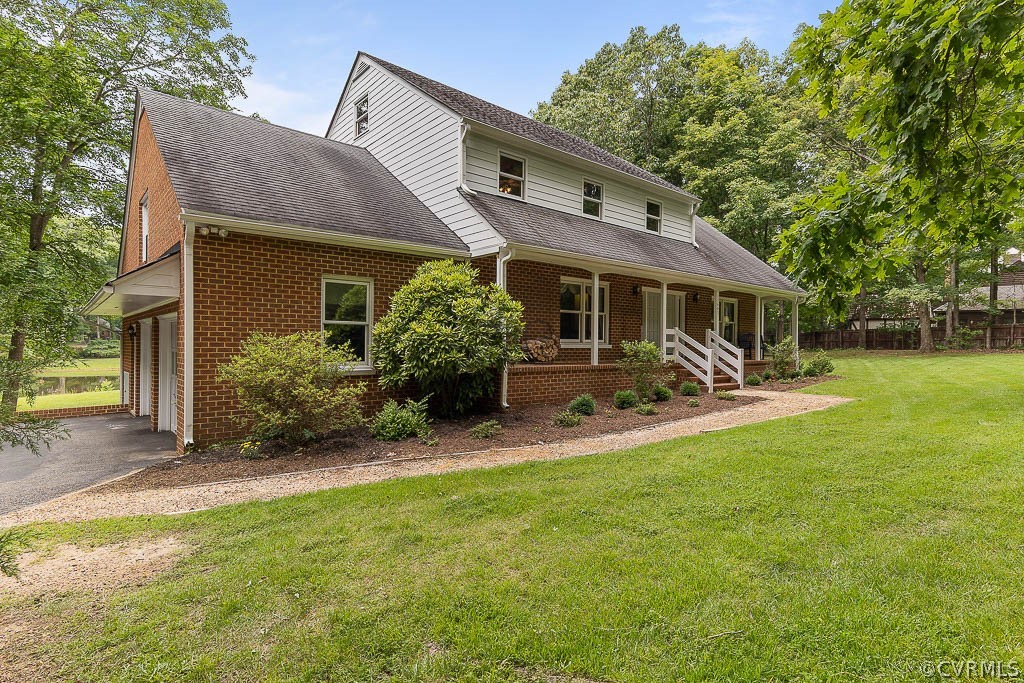 13661 Kingsmill Road Midlothian, VA 23113 - Photo 3 of 50 a front view of house with yard and green space