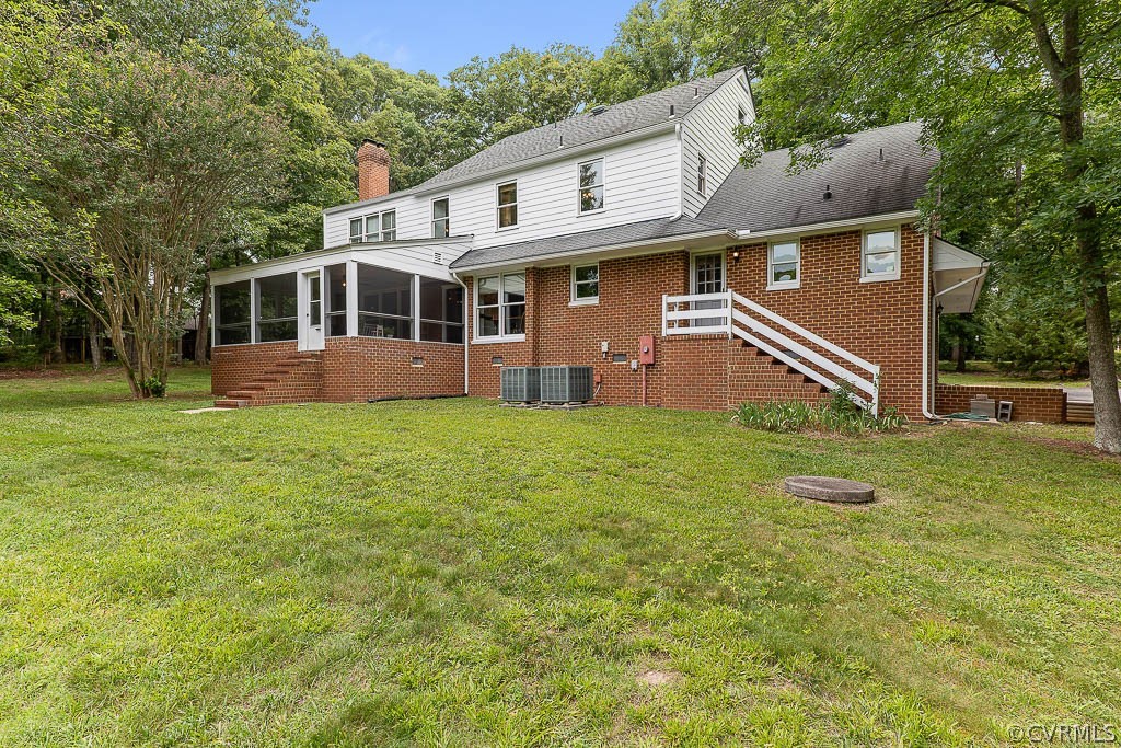 13661 Kingsmill Road Midlothian, VA 23113 - Photo 39 of 50 a front view of a house with a yard and trees
