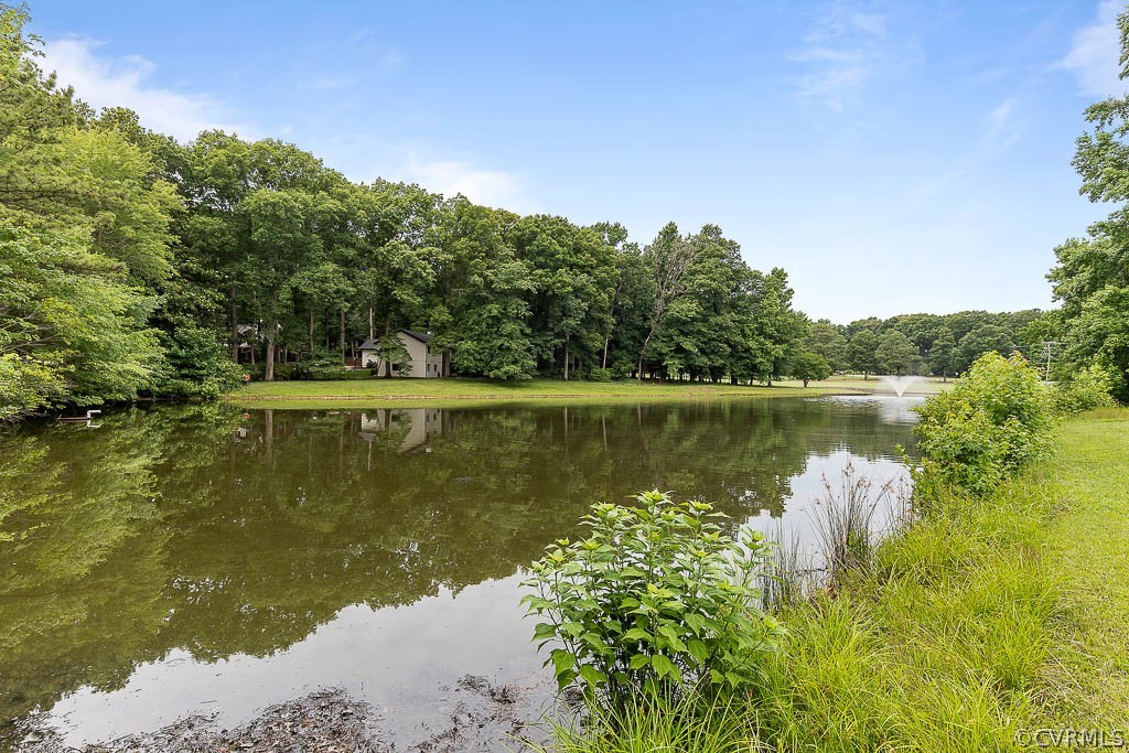 13661 Kingsmill Road Midlothian, VA 23113 - Photo 42 of 50 a view of a lake with a yard