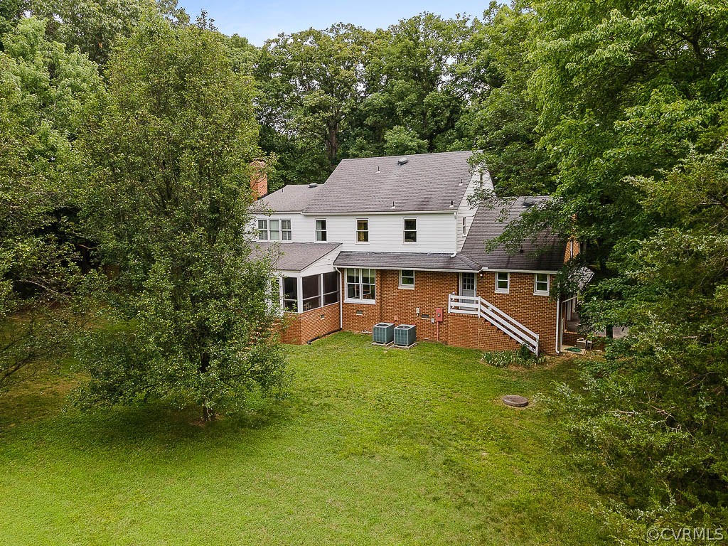 13661 Kingsmill Road Midlothian, VA 23113 - Photo 49 of 50 an aerial view of a house with swimming pool garden view and trees