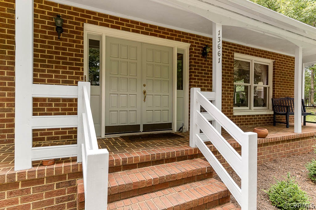 13661 Kingsmill Road Midlothian, VA 23113 - Photo 5 of 50 a front view of a house with a window