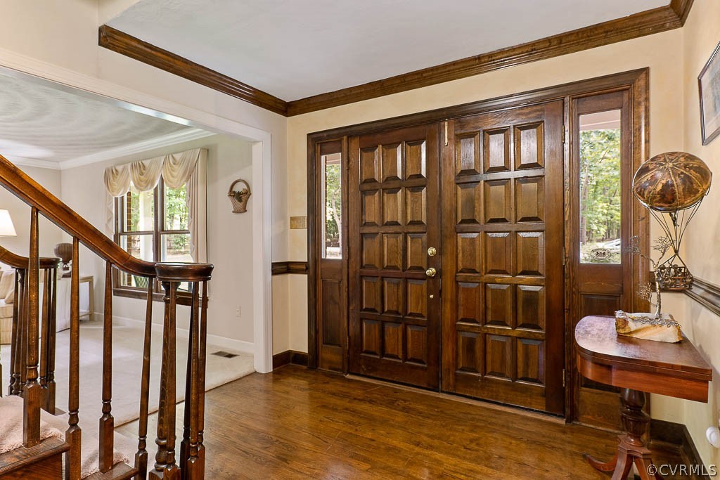 13661 Kingsmill Road Midlothian, VA 23113 - Photo 7 of 50 a view of a hallway with wooden floor and entryway
