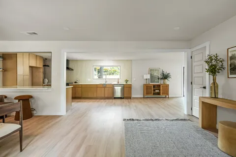 a view of a living room and dining room