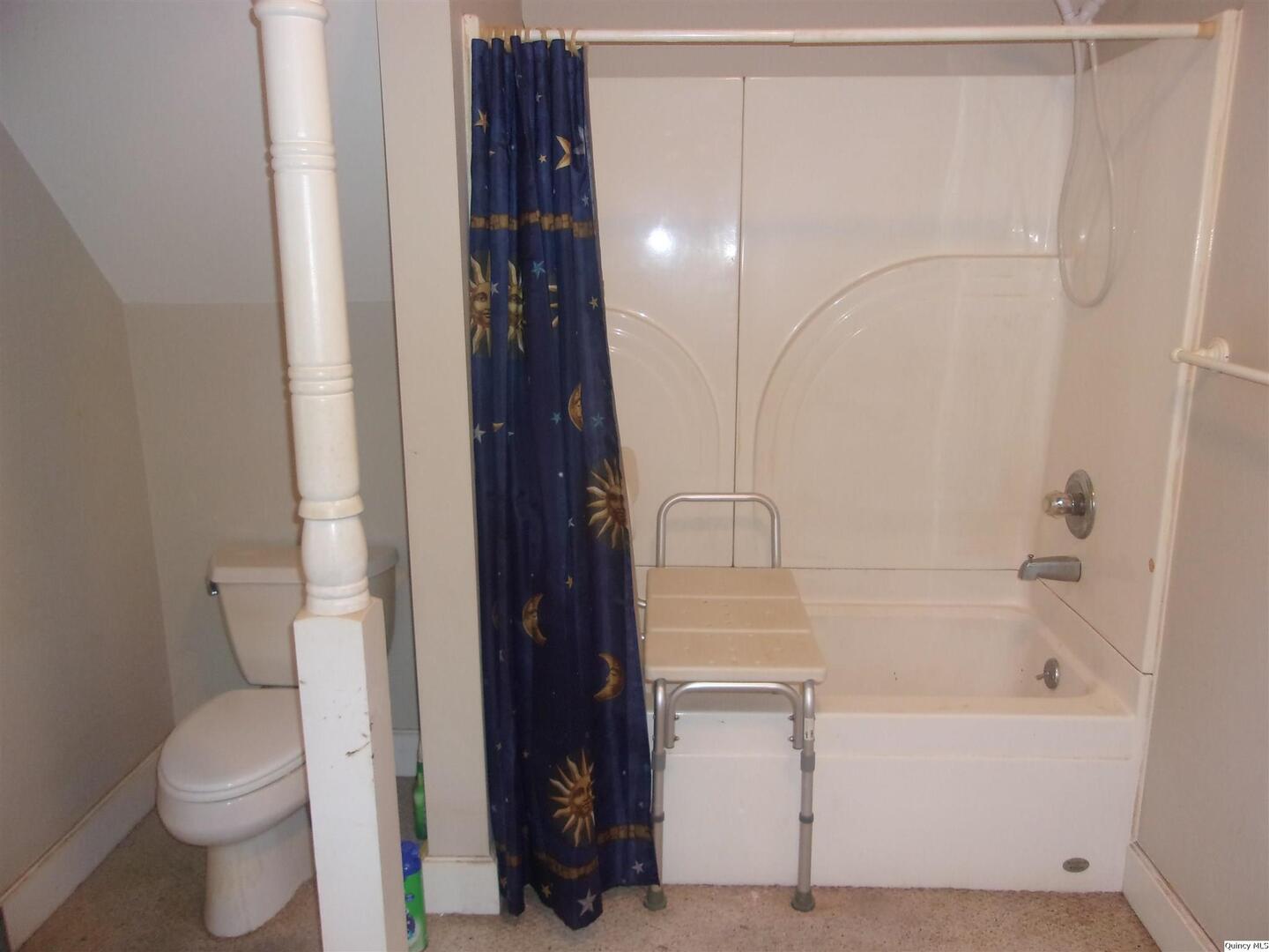 740 South 14th Street Quincy, IL 62301 - Photo 15 of 20 a bathroom with a shower and a toilet