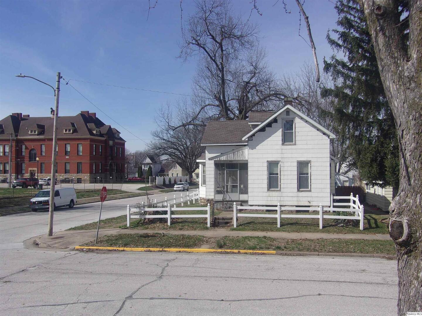 740 South 14th Street Quincy, IL 62301 - Photo 2 of 20 a front view of a house with a yard