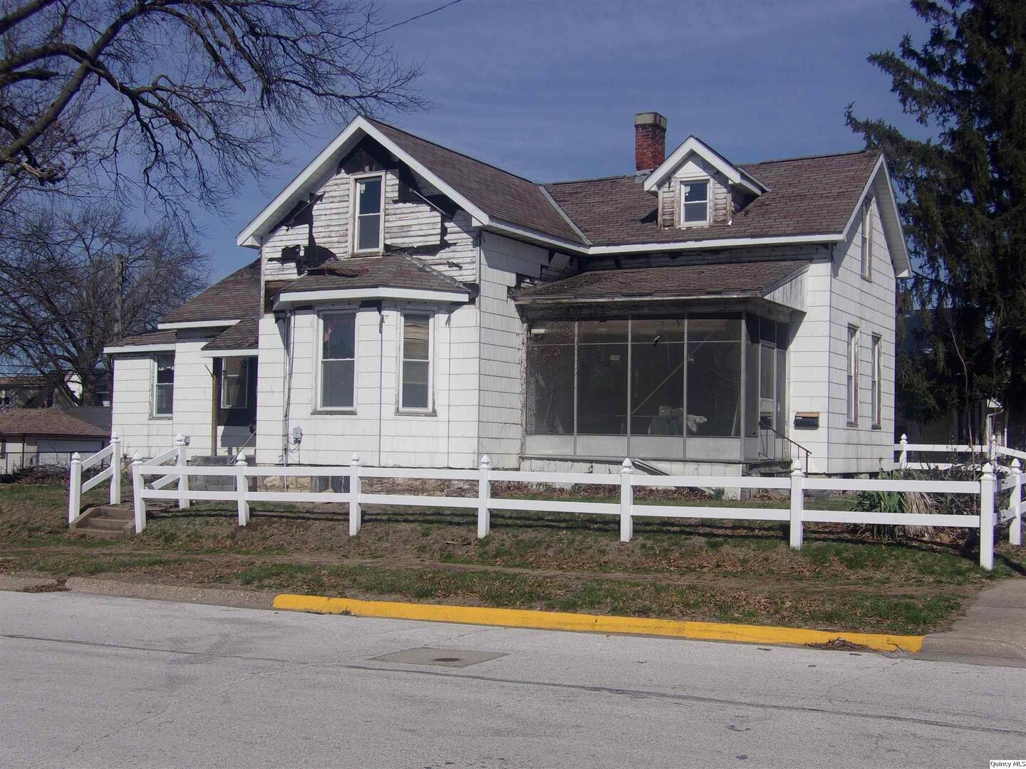 740 South 14th Street Quincy, IL 62301 - Photo 4 of 20 a view of a house with a swimming pool and a yard