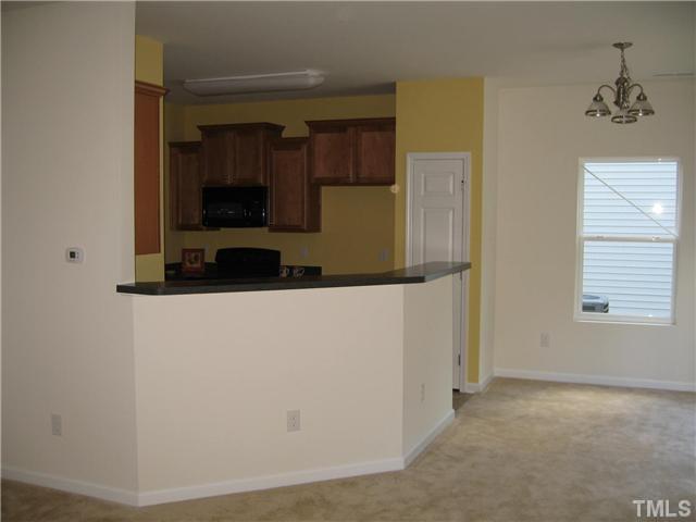 2600 Shepherd Valley Street, Unit LOT74 Raleigh, NC 27610 - Photo 4 of 9 View of the kitchen from the family room.