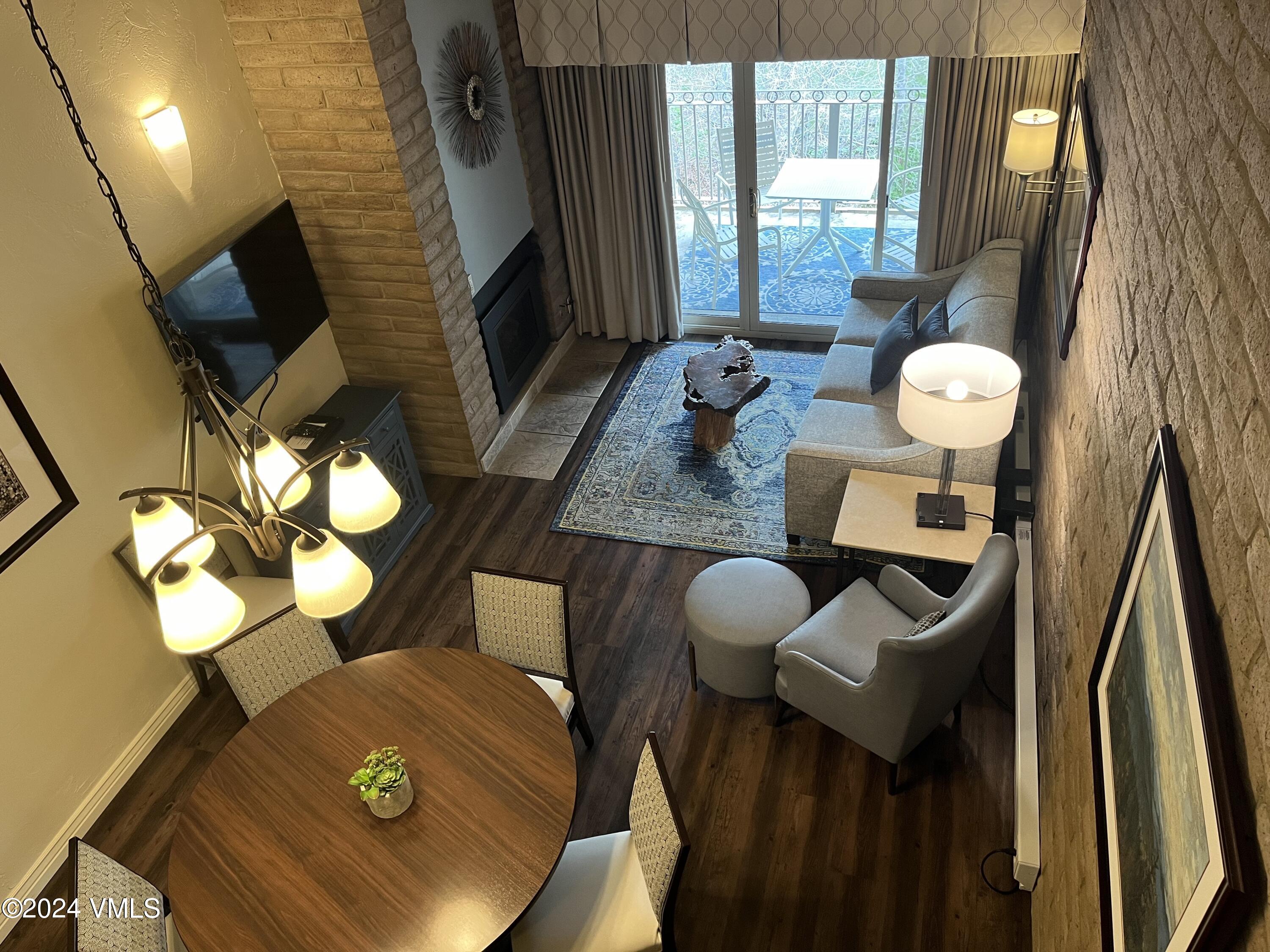 1020 Vail View Drive, Unit 340241 Vail, CO 81657 - Photo 18 of 32 a view of a dining room with furniture and a chandelier