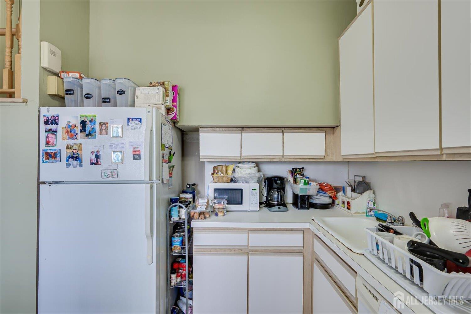 44 McKinley Avenue Colonia, NJ 07067 - Photo 12 of 38 a kitchen with a refrigerator and a sink