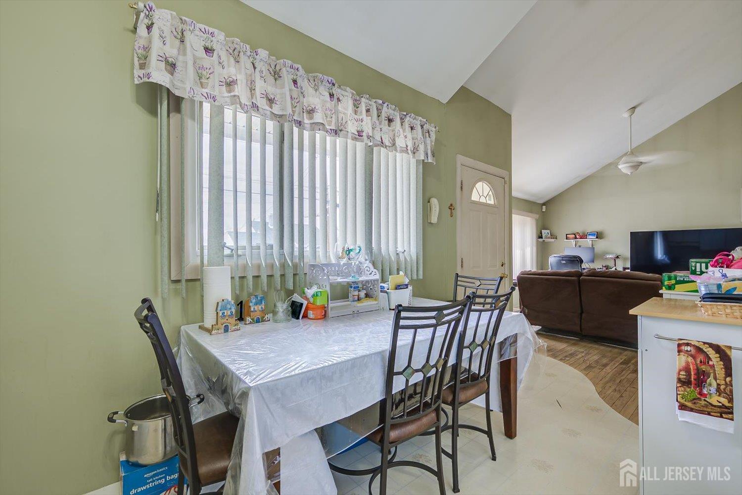 44 McKinley Avenue Colonia, NJ 07067 - Photo 13 of 38 a view of a dining room with furniture and window