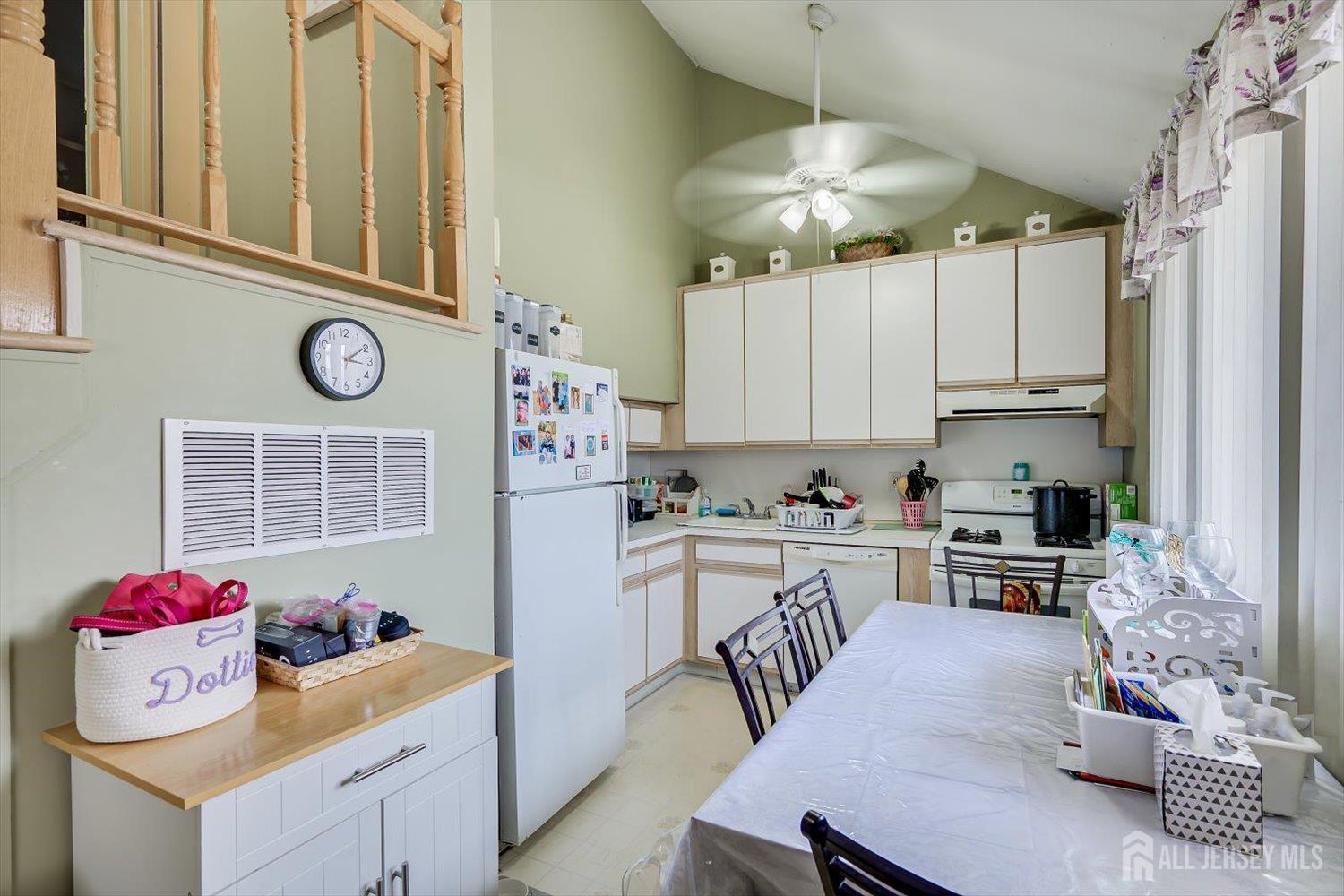 44 McKinley Avenue Colonia, NJ 07067 - Photo 14 of 38 a kitchen with a refrigerator and cabinets