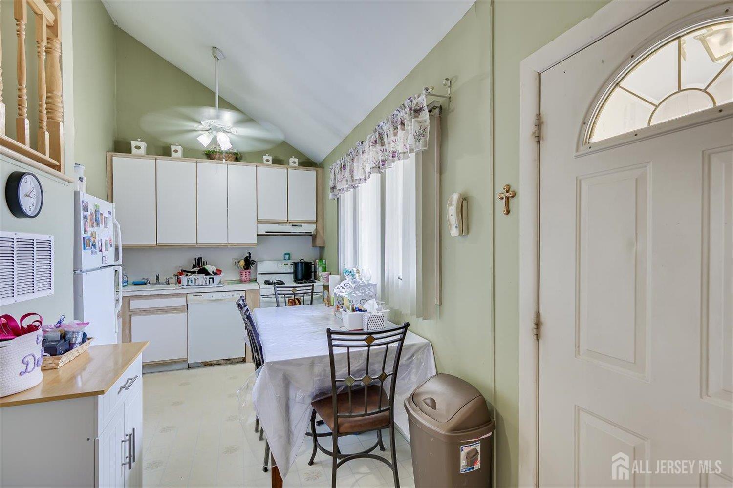 44 McKinley Avenue Colonia, NJ 07067 - Photo 15 of 38 a kitchen with a refrigerator and a stove top oven