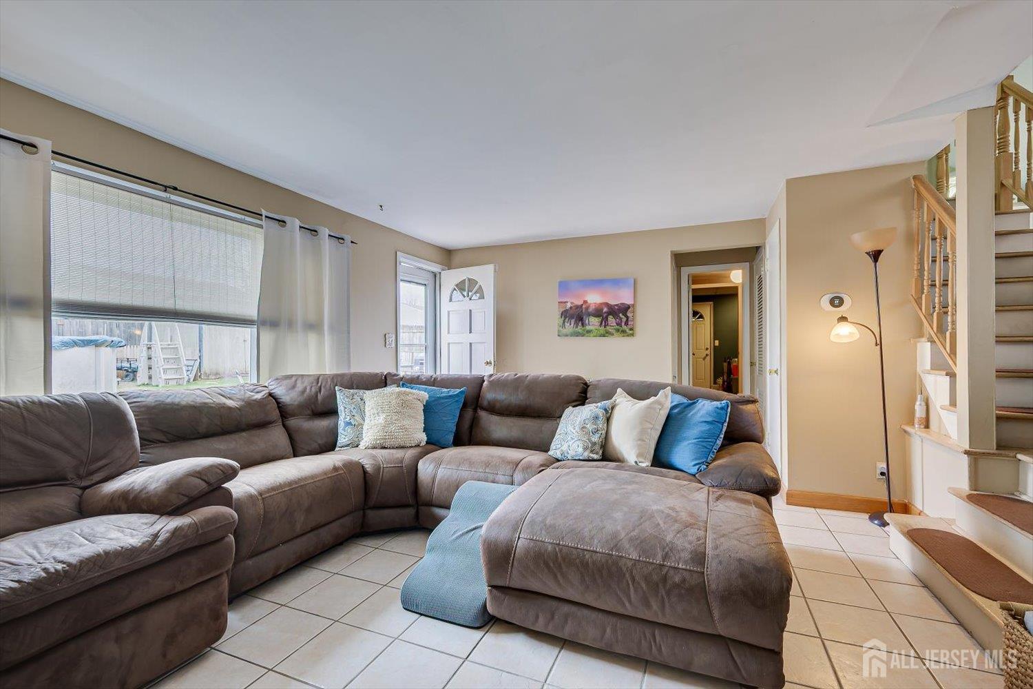 44 McKinley Avenue Colonia, NJ 07067 - Photo 17 of 38 a living room with furniture and a couch