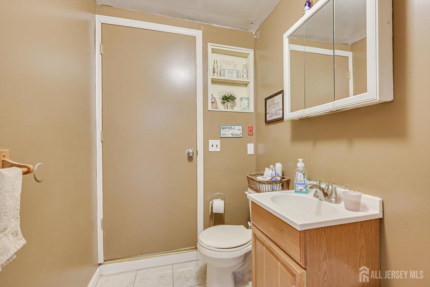 44 McKinley Avenue Colonia, NJ 07067 - Photo 20 of 38 a bathroom with a sink toilet and shower
