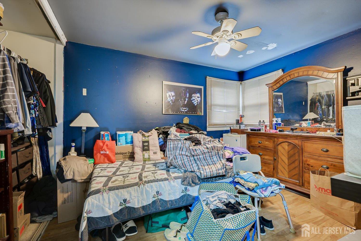 44 McKinley Avenue Colonia, NJ 07067 - Photo 26 of 38 a living room with furniture flowerpot and a chandelier