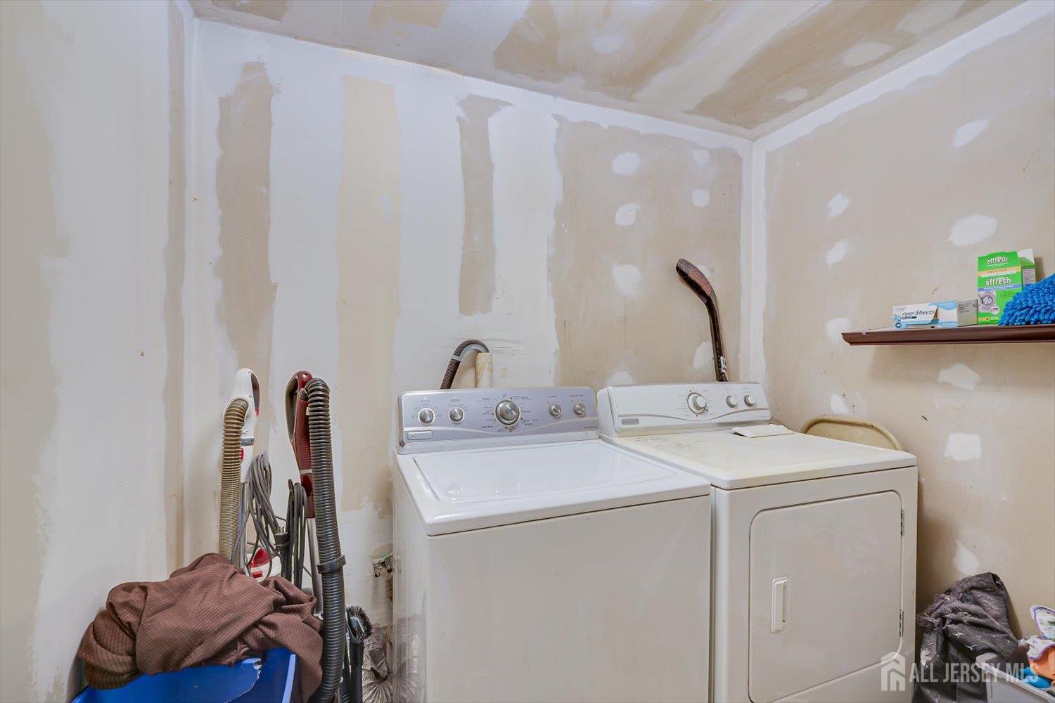 44 McKinley Avenue Colonia, NJ 07067 - Photo 28 of 38 a utility room with dryer and washer