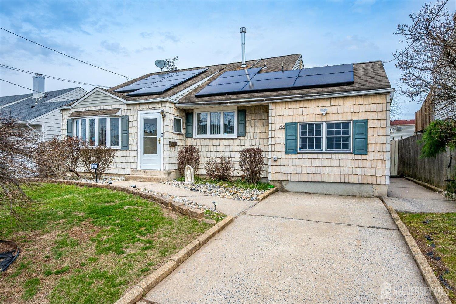 44 McKinley Avenue Colonia, NJ 07067 - Photo 3 of 38 a front view of a house with a yard
