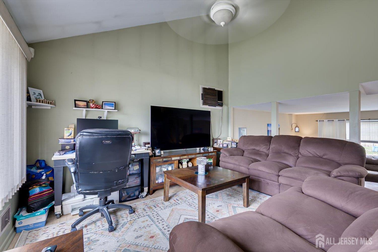 44 McKinley Avenue Colonia, NJ 07067 - Photo 8 of 38 a living room with furniture and a flat screen tv