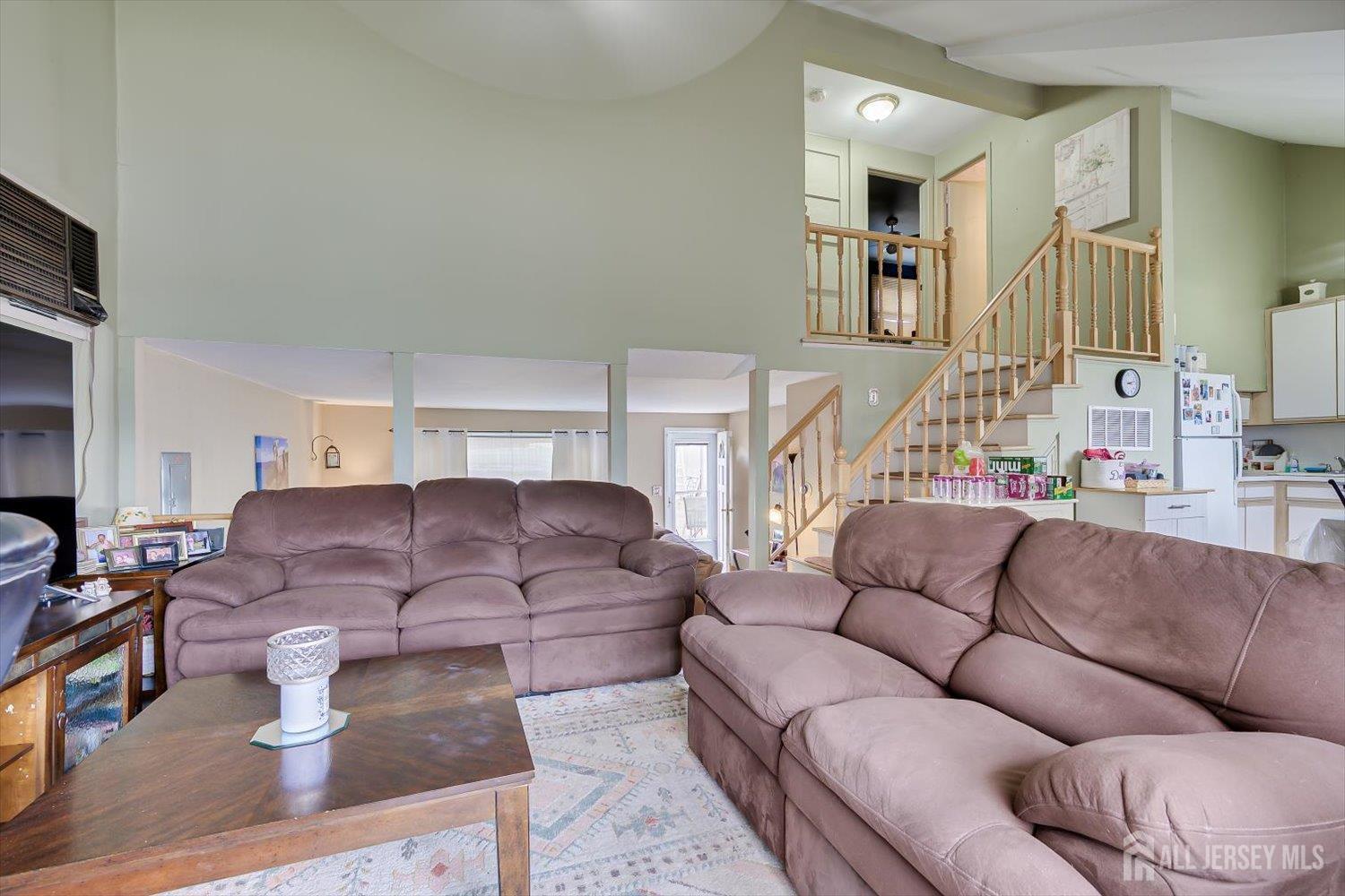 44 McKinley Avenue Colonia, NJ 07067 - Photo 10 of 38 a living room with furniture and a large window