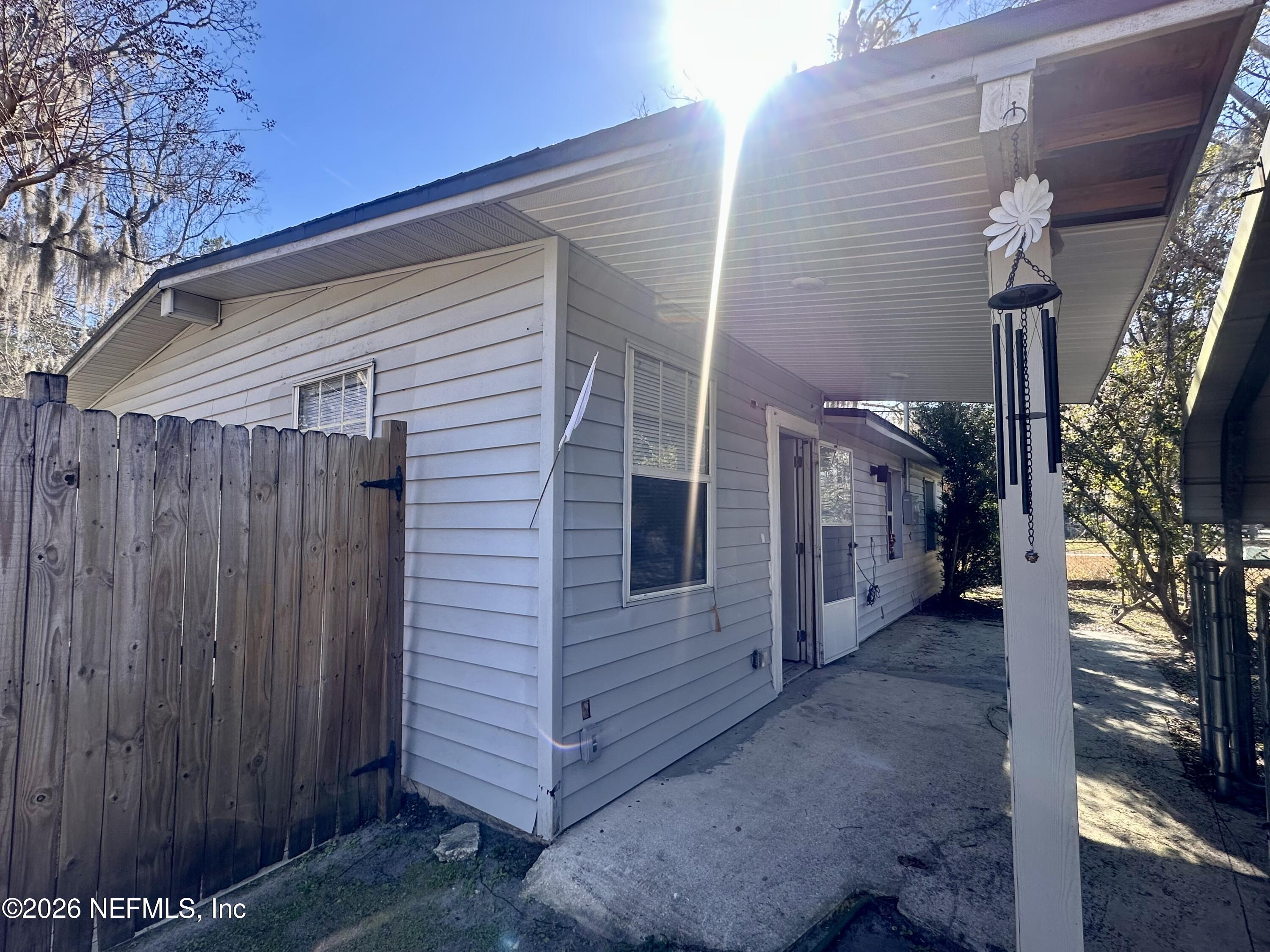 11335 Wingate Road North Jacksonville, FL 32218 - Photo 1 of 17 a view of a house with a backyard