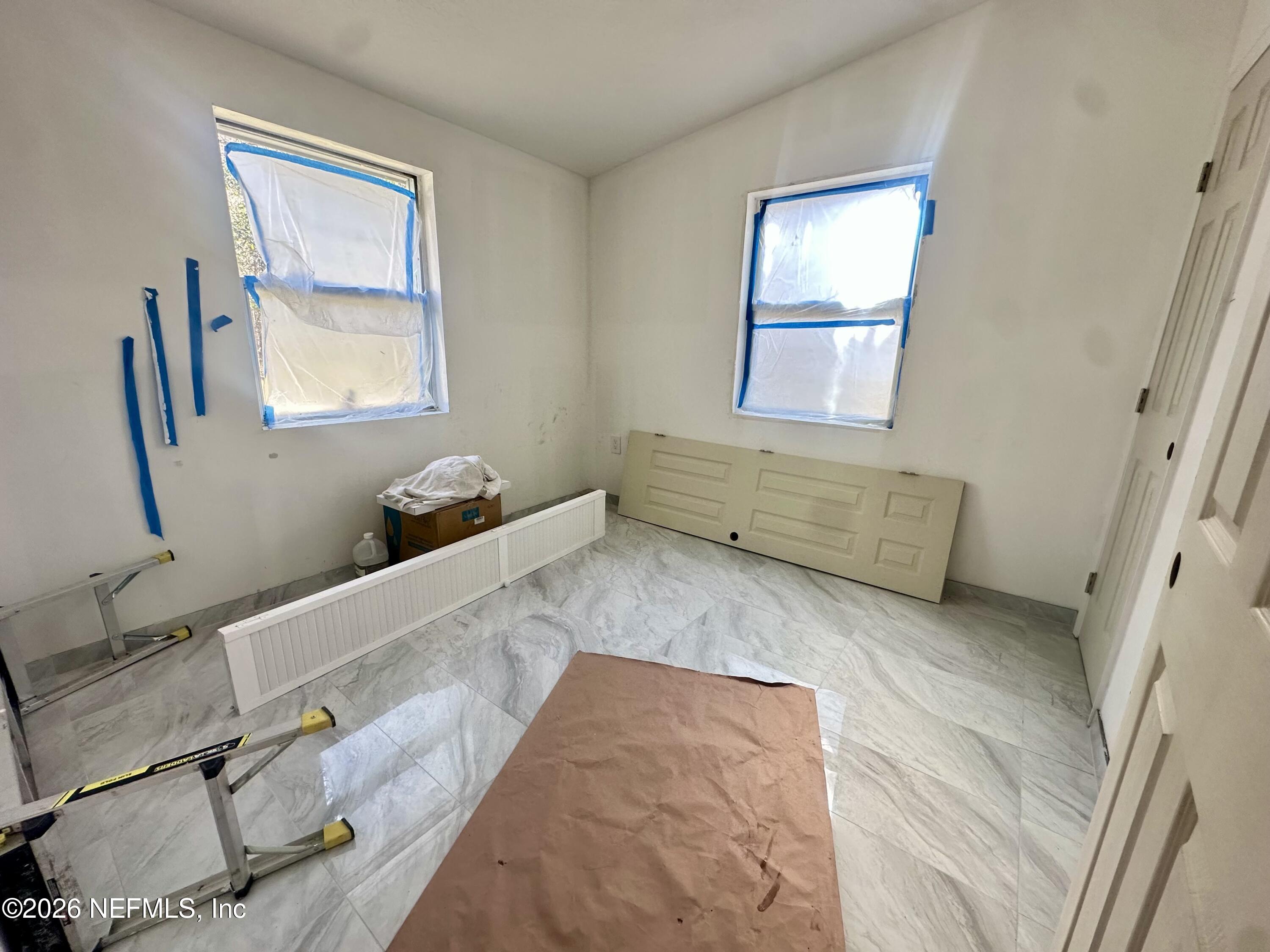 11335 Wingate Road North Jacksonville, FL 32218 - Photo 12 of 17 a bathroom with a tub sink and mirror