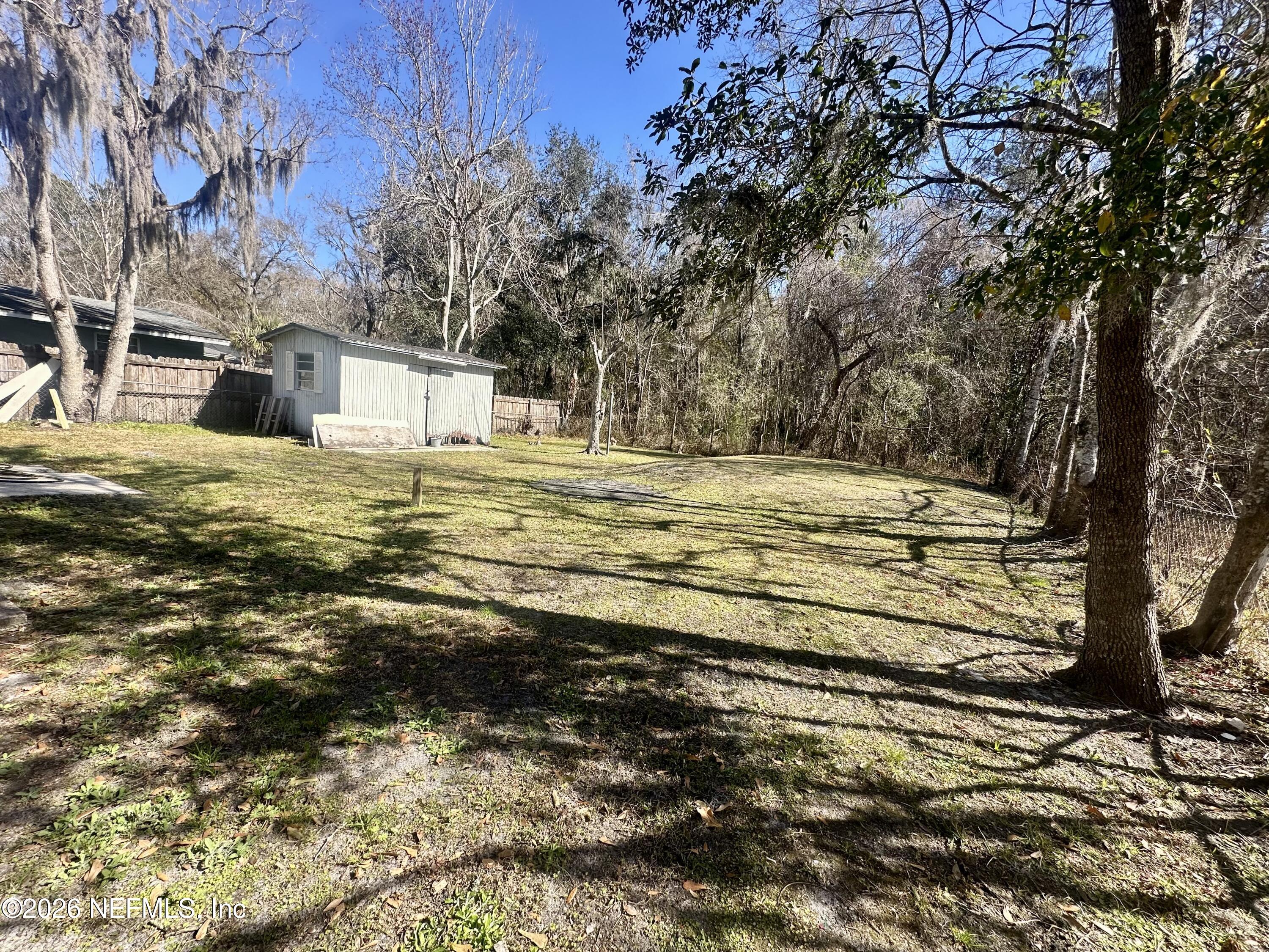 11335 Wingate Road North Jacksonville, FL 32218 - Photo 16 of 17 a view of a house with a yard
