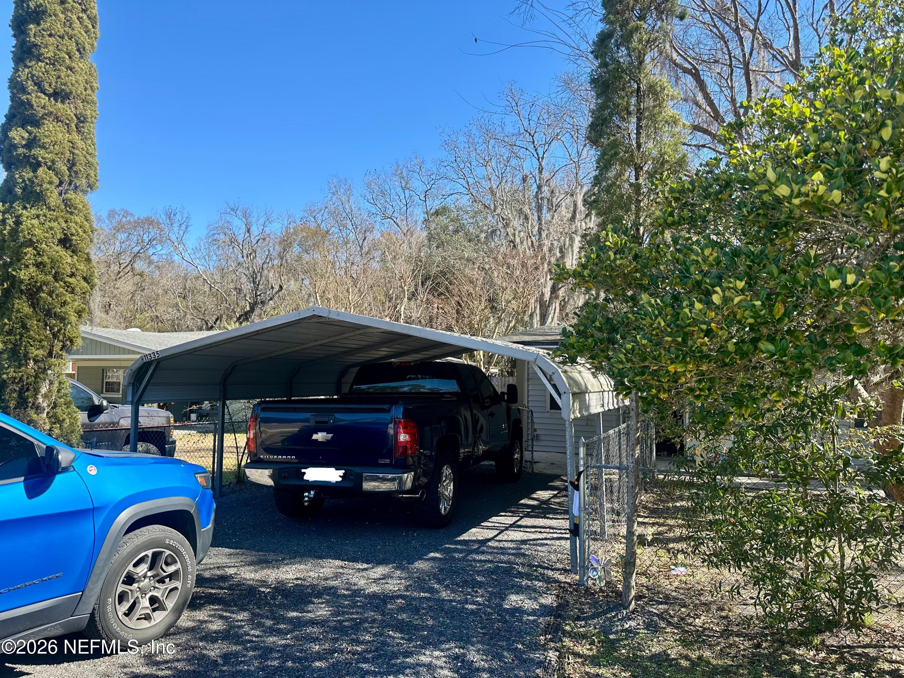 11335 Wingate Road North Jacksonville, FL 32218 - Photo 4 of 17 a front view of a house with parking space