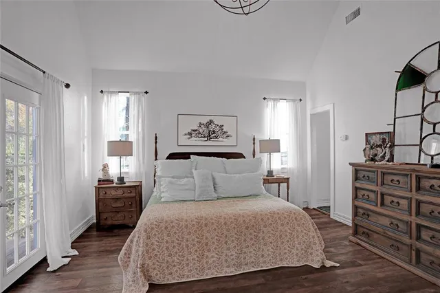 a kitchen with a table a stove and cabinets