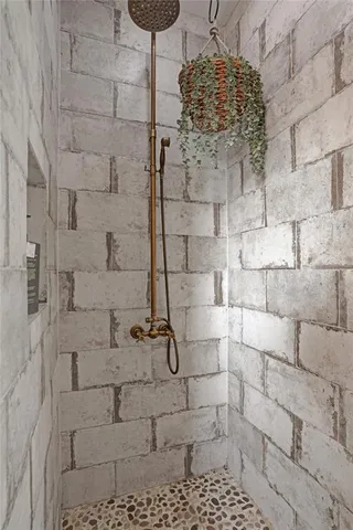 a bathroom with a granite countertop sink a toilet and a mirror