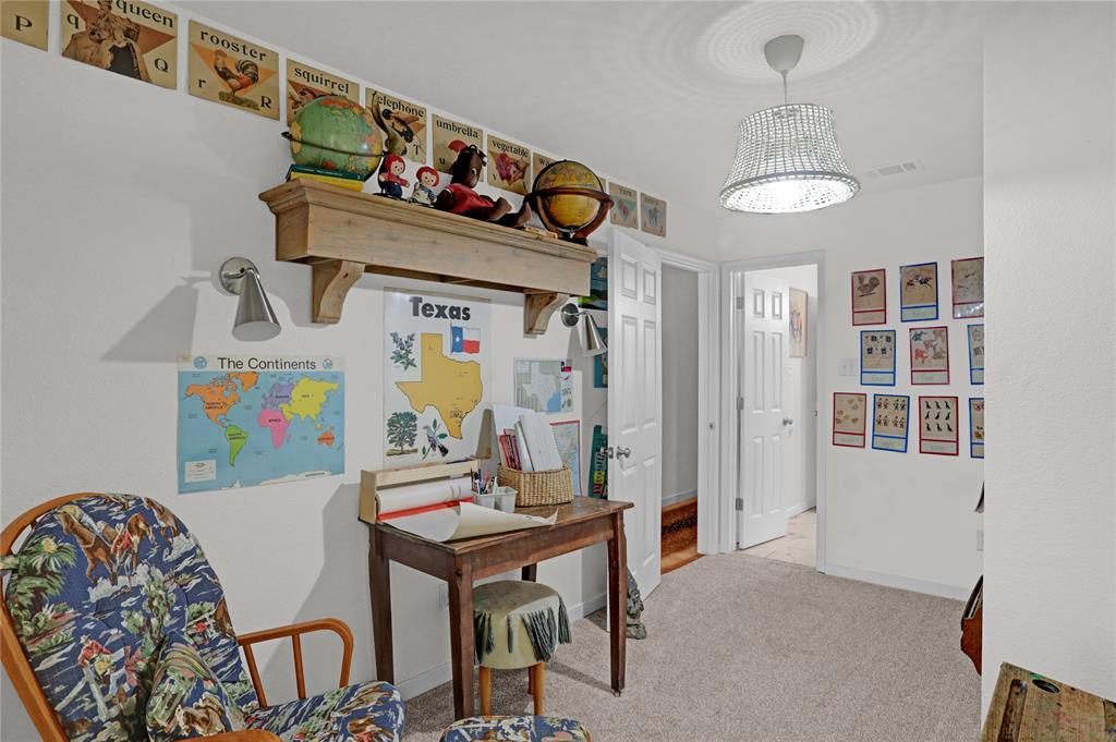 7070 Armadillo Rdg Road McKinney, TX 75071 - Photo 22 of 34 a view of a dining room with furniture and chandelier