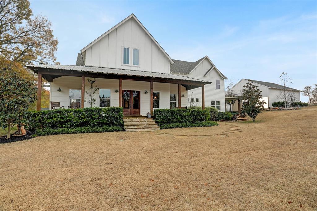 7070 Armadillo Rdg Road McKinney, TX 75071 - Photo 28 of 34 a front view of a house with a yard and garage