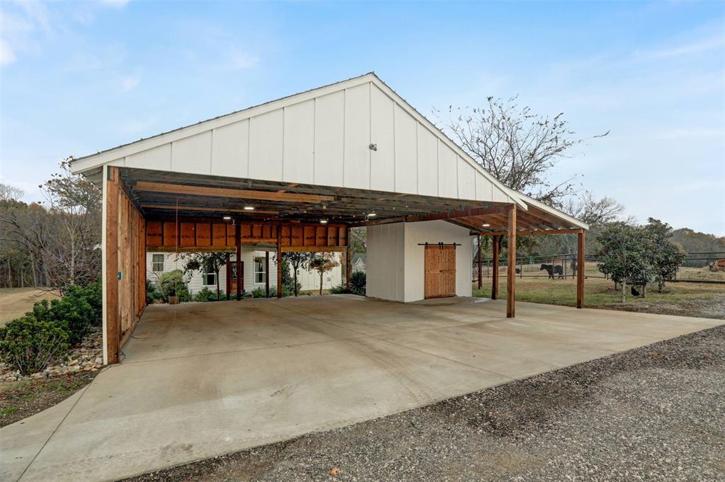 7070 Armadillo Rdg Road McKinney, TX 75071 - Photo 30 of 34 a front view of a house with a garage