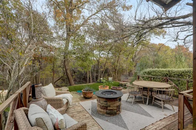 a view of a patio with wooden floor