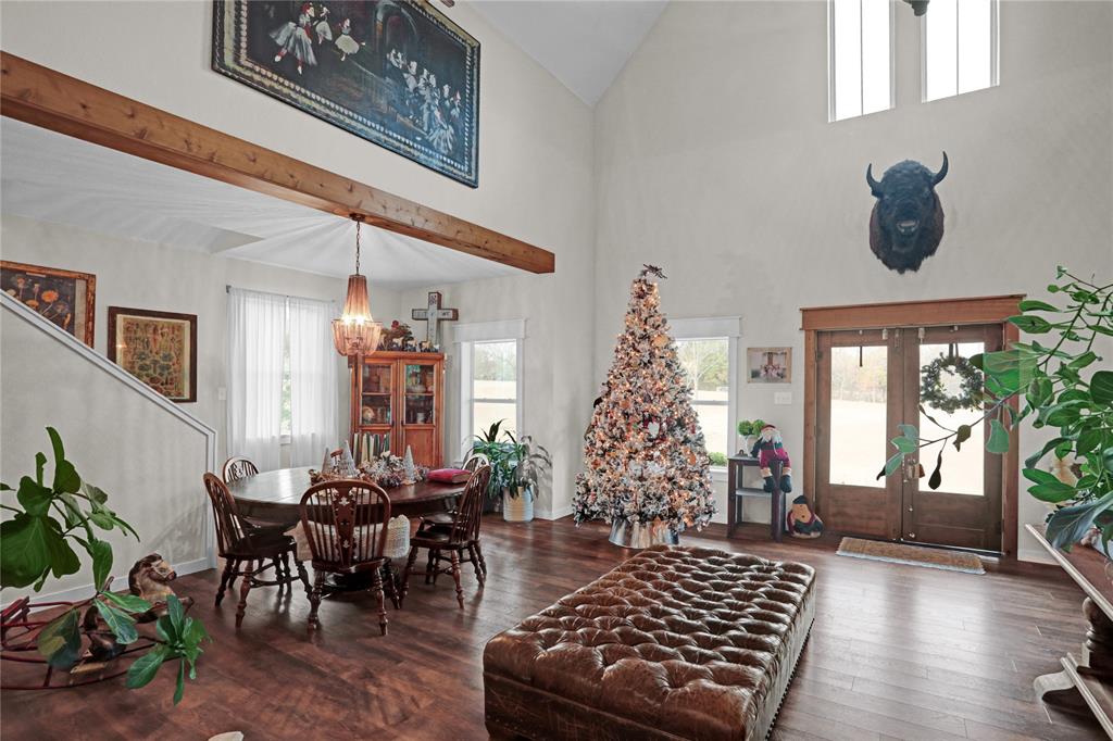 7070 Armadillo Rdg Road McKinney, TX 75071 - Photo 4 of 34 a living room with furniture and a chandelier