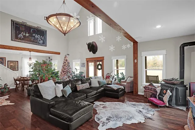 a living room with furniture or couch and a large window