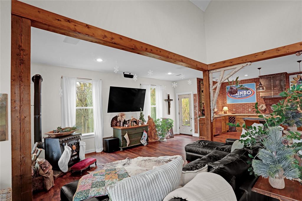 7070 Armadillo Rdg Road McKinney, TX 75071 - Photo 8 of 34 a bedroom with furniture a flat screen tv and a window