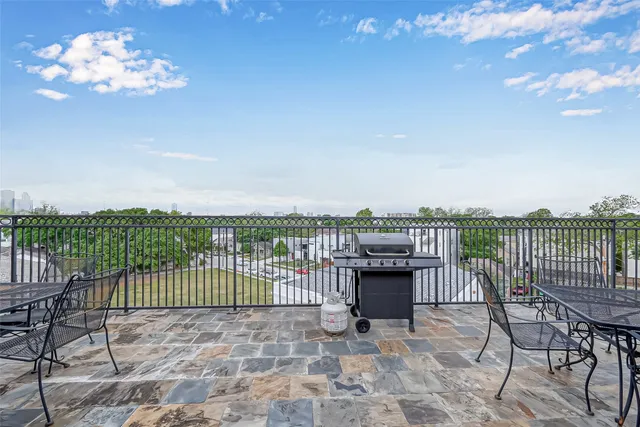 a view of a balcony with an outdoor seating