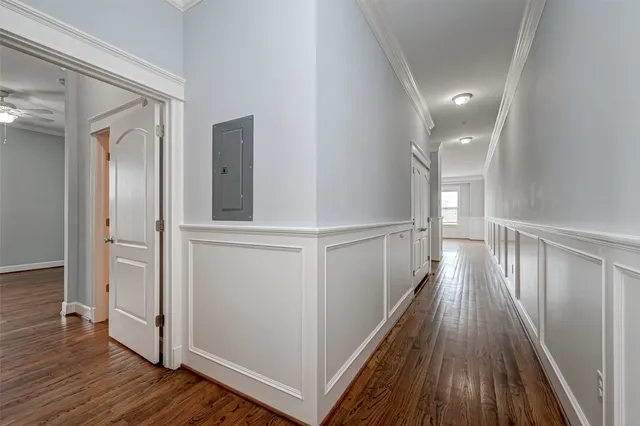 a view of gallery with wooden floor