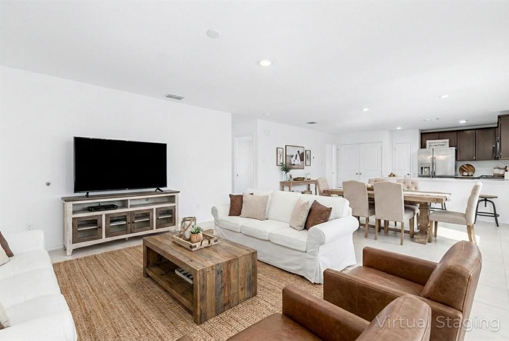 7524 Larson Lane McKinney, TX 75071 - Photo 12 of 24 a living room with furniture and a flat screen tv