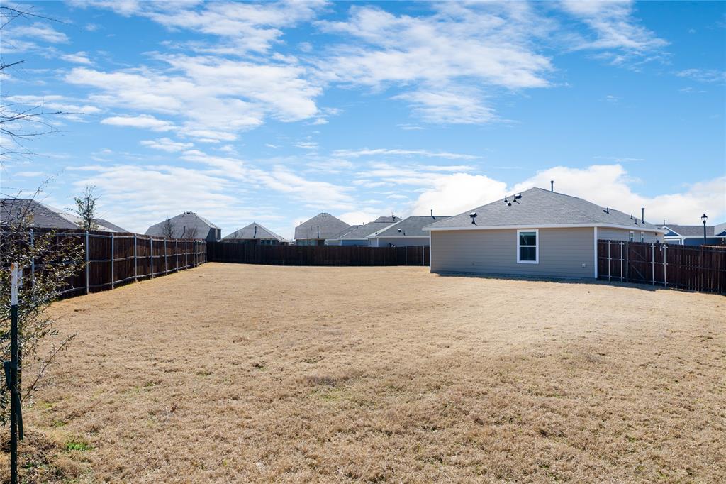 7524 Larson Lane McKinney, TX 75071 - Photo 22 of 24 a house with yard in front of it
