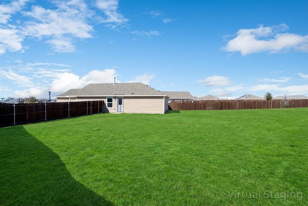 7524 Larson Lane McKinney, TX 75071 - Photo 23 of 24 a front view of a house with garden and a yard