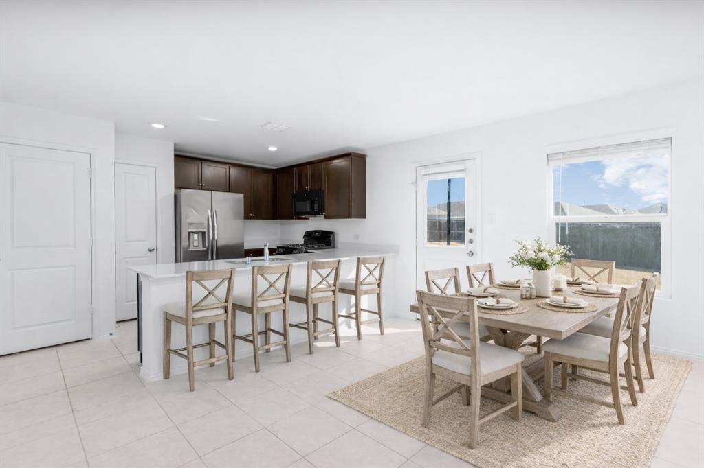 7524 Larson Lane McKinney, TX 75071 - Photo 9 of 24 a view of a dining room with furniture
