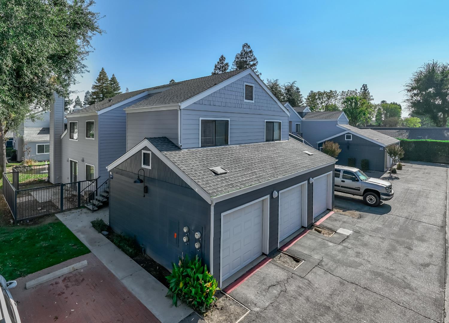 a aerial view of a house with a yard and garage