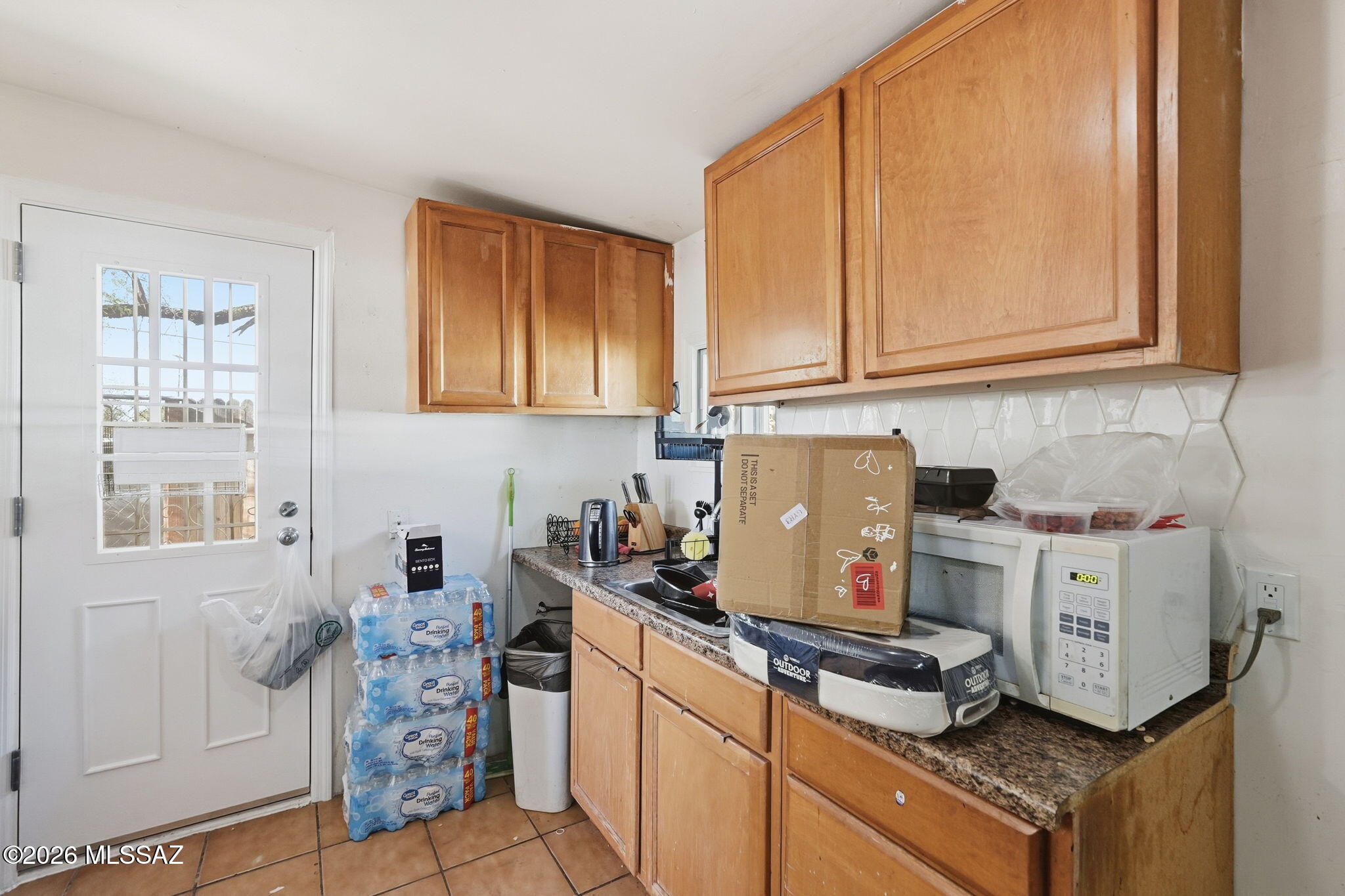 426 East Aragon Road, Unit 1 Tucson, AZ 85756 - Photo 8 of 18 a kitchen with stainless steel appliances granite countertop a stove and a refrigerator