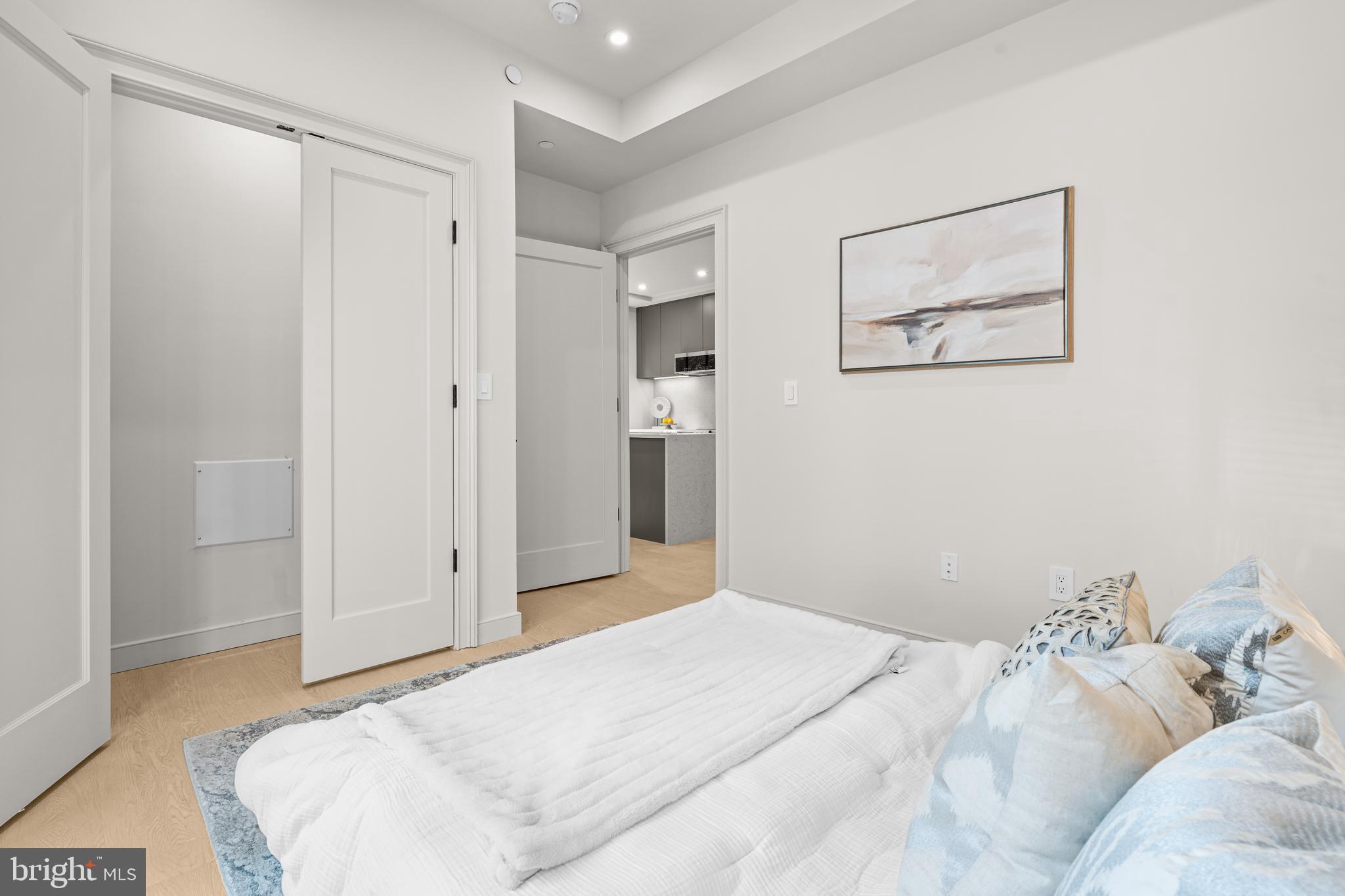 2121 Ward Place Northwest, Unit 404 Washington, DC 20037 - Photo 11 of 19 a bedroom with a bed and the view of bathroom