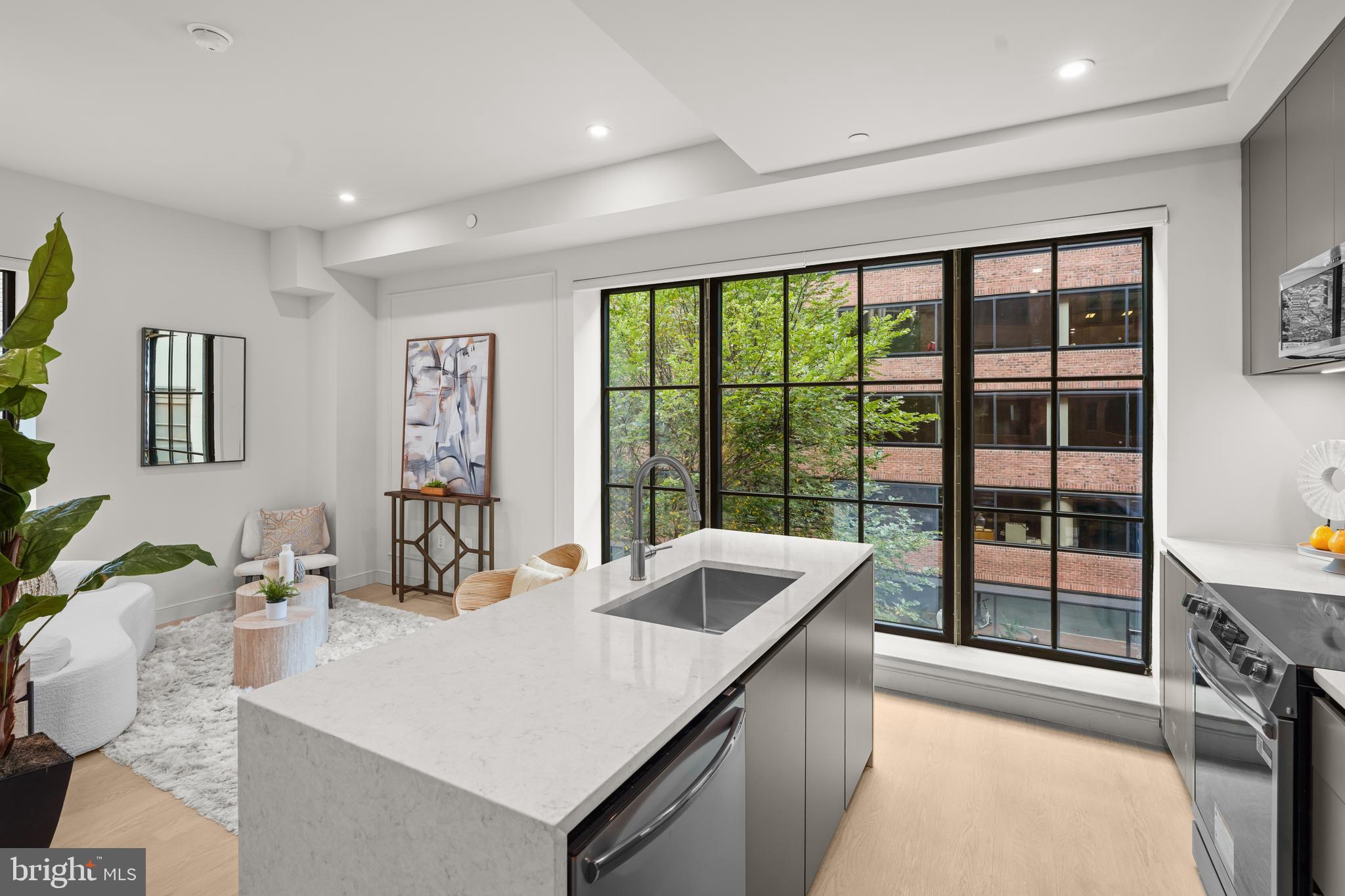 2121 Ward Place Northwest, Unit 404 Washington, DC 20037 - Photo 7 of 19 a kitchen with a sink and large window