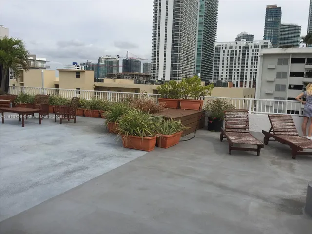 a view of a terrace with sitting area